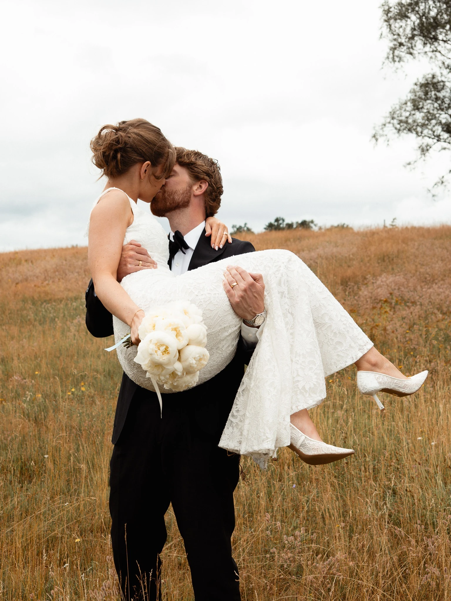 Carrying the bride across the field